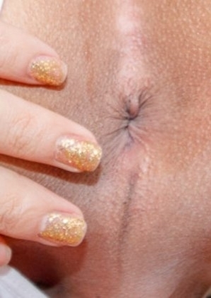 Ladyboy Phatida is wearing a sexy white blouse with panties and stockings. She begins to squeeze her tits together over her blouse and her nipples pop