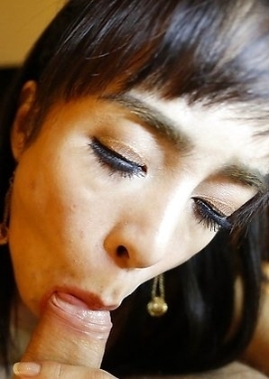 Thai ladyboy Poy gives a pov blowjob to a fat white cock