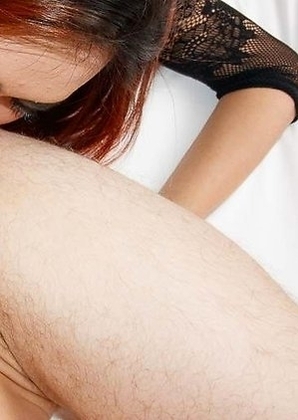 Many tight slender body is wrapped in a black body stocking with a cute little tie and mini skirt.