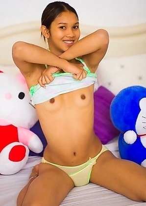 Teenage Ladyboy Lee with small tits plays with stuffed animals