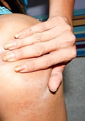 Khawn bends over and spreads her ass-pussy wide and heads over to a chair in the corner to get a little more comfortable. She strokes her hole a littl