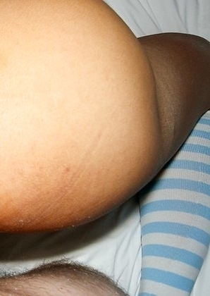 Khawn bends over and spreads her ass-pussy wide and heads over to a chair in the corner to get a little more comfortable. She strokes her hole a littl