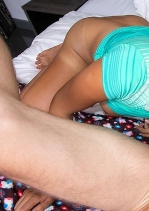 Cute Ladyboy Nim is wearing a tight striped green dress over her curvy tanned body.