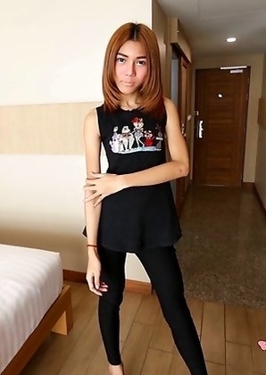 19 year old shy Thai ladyboy May gets naked and does a striptease